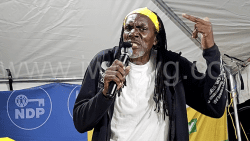 Aster John aka Ras John campaigning with the opposition New Democratic Party in Town Hill on Sept. 1, 2025.