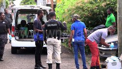 Police and funeral home workers at the scene in Layou on Saturday, Sept. 134, 2025.