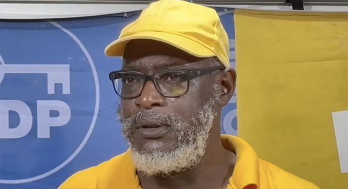 Retired public servant Harvey Farrell, a former executive member of the Public Service Union, who is assistant secretary general of the main opposition New Democratic Party, campaigning with the party in Mahaut.