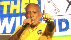 Opposition Leader Godwin Friday speaking at the New Democratic Party's DJ Sound Clash in Campden Park on Saturday, Oct. 11, 2025.