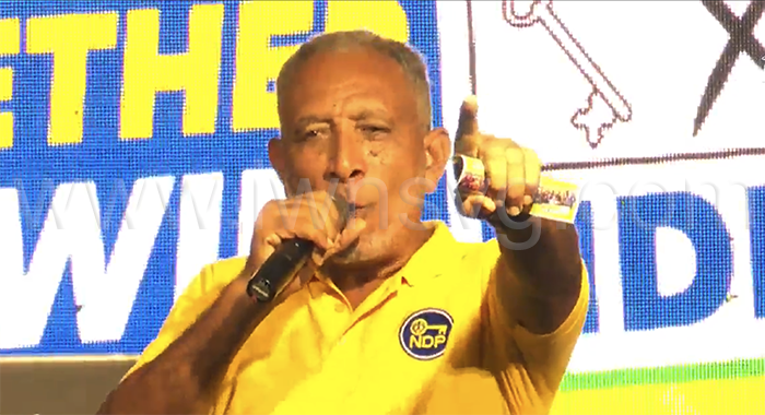 Opposition Leader Godwin Friday speaking at the New Democratic Party's DJ Sound Clash in Campden Park on Saturday, Oct. 11, 2025.