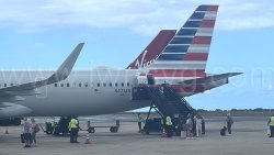 Passengers disembark from an American Airlines aircraft in Barbados on Sunday, Oct. 5, 2025.