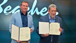 Prime Minister of St. Vincent and the Grenadines, Ralph Gonsalves, right, and CEO of Sandals Resorts International, Adam Stewart, hold up the signed agreement at the ceremony in Buccament Bay on Monday, Oct. 6, 2025. (Photo: Facebook/API)