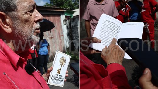 Prime Minister Ralph Gonsalves holds up a copy of the book “New Democratic Party’s Plans for St. Vincent and the Grenadines” in Georgetown on Monday, Nov. 10, 2025. 