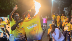 New Democratic Party supporters celebrate outside the party's headquarters in Kingstown on Thursday, Nov. 25, 2025. 