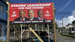For the second consecutive election cycle, Prime Minister Ralph Gonsalves, 79, features alongside his son, Finance Minister Camillo Gonsalves, 53, left, and Agriculture Minister Saboto Caesar, 43, on a billboard about future leadership. 