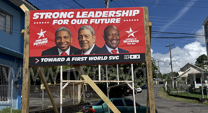 For the second consecutive election cycle, Prime Minister Ralph Gonsalves, 79, features alongside his son, Finance Minister Camillo Gonsalves, 53, left, and Agriculture Minister Saboto Caesar, 43, on a billboard about future leadership. 