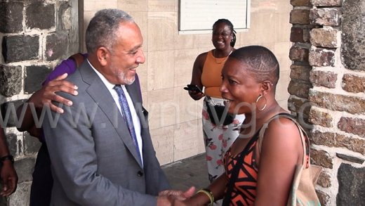 Prime Minister Godwin Friday interacts with people in Kingstown on Friday, Dec. 19, 2025.