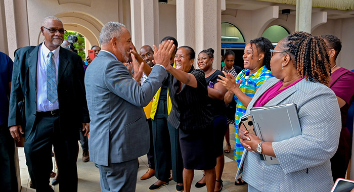 Public servants greet Prime Minister Godwin Friday as he arrived at the Administrative Complex on Monday, Dec. 1, 2025. (Photo: Facebook/API)
