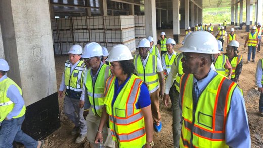 Minister of Health Daniel Cummings, front right, among government and other officials on a tour of the construction site of the hospital at Arnos Vale on Friday, Jan. 23, 2024.