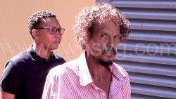 The accused, Emmanuel Matthews, 59, in police custody outside the Serious Offences Court in Kingstown on Wednesday, Dec. 31, 2025. 