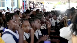 Questelles Government School students during their school's assembly on Monday, Jan. 5, 2026, the first day of Term II, one week after a fire destroyed a block at the century-old school. 