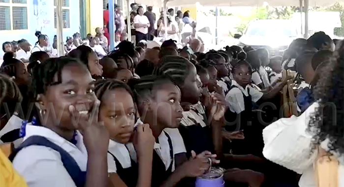 Questelles Government School students during their school's assembly on Monday, Jan. 5, 2026, the first day of Term II, one week after a fire destroyed a block at the century-old school. 