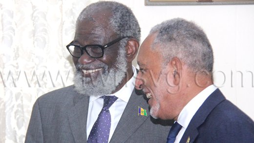 Governor General Stanley "Stalky" John, left, and Prime Minister Godwin Friday interact after John installation at Government House in Old Montrose on Tuesday, Jan. 6, 2026.