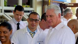 President of Cuba, Miguel Díaz-Canel, right, pose with Cuba health workers at a public hospital in Georgetown, St. Vincent in December 2020. (Photo: Facebook/ APISVG)