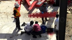 An ambulance crew attends to construction worker Lemone Baptiste after he fell from a four-storey steel frame where a building is being construction in Villa on Wednesday, Feb. 4, 2026.