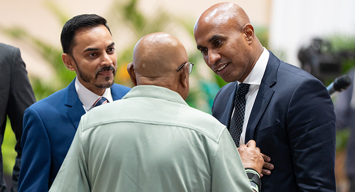 Massy Group President and CEO James Mc Letchie, right, and Executive Vice President and CEO, Motors & Machines Portfolio Ryan Latchu, left, at the Massy Group's 102nd annual general meeting in Trinidad on Jan. 26, 2026.