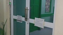 A photo of the newly installed main entrance door, which includes a bell system.