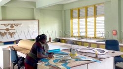 A member of Blondie Bird and Friends works on the mas band’s 2026 presentation on Saturday, March 28, 2026, one week after production began at the Thomas Saunders Secondary School campus in Kingstown.