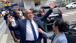 Prime Minister Godwin Friday gestures and comments about the beautiful weather outside the High Court in Kingstown on Thursday, March 5, 2026, after a hearing in an election petition challenging his election in the Nov. 27, 2025, general election. 