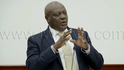 Minister of Housing, Andrew John, speaking in Parliament on Tuesday, April 21, 2026.