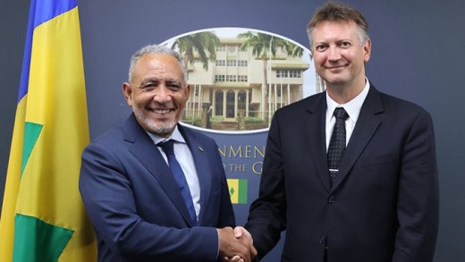Prime Minister and Minister of Finance of St. Vincent and the Grenadines, Godwin Friday, left, and Sergei Antoshin, the International Monetary Fund mission chief for SVG, shake hands at a press conference in Kingstown on Tuesday, April 28, 2026. 