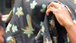 The defendant, Fidel Francois, hides his face as he leaves the Kingstown Magistrate’s Court on March 23, 2026