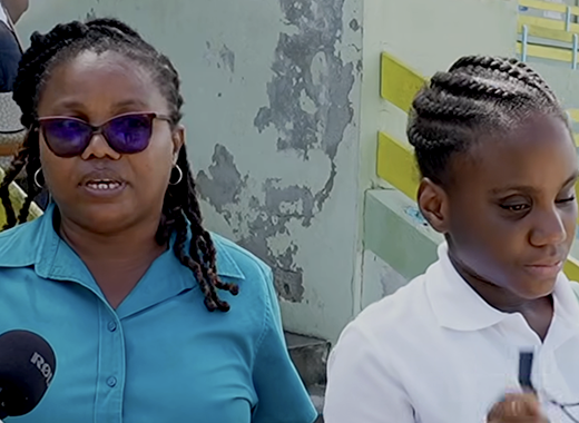Yolanda Grant, left, and her blind daughter, Faith Grant, who placed 19th for girls and 43rd among the 1,760 students in St. Vincent and the Grenadines who wrote this year’s  CPEA. (Photo: SVGTV)