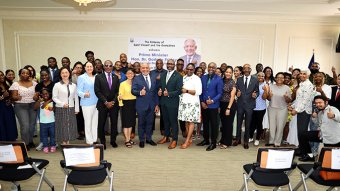 Prime Minister Godwin Friday and his wife, Ave Friday, pose with Vincentians in Taiwan and their guests during a luncheon in Taipei, Taiwan on Saturday, Aug. 15, 2026.