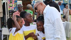 Prime Minister Godwin Friday interacts with children at the Emancipation Day event at Independence Park in Kingstown on Saturday, Aug. 1, 2026. 