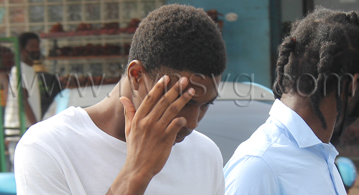 Teen killer Tyshaun Spring hides his face as he is led back to prison on July 24, 2026, to complete his sentence for murder. 