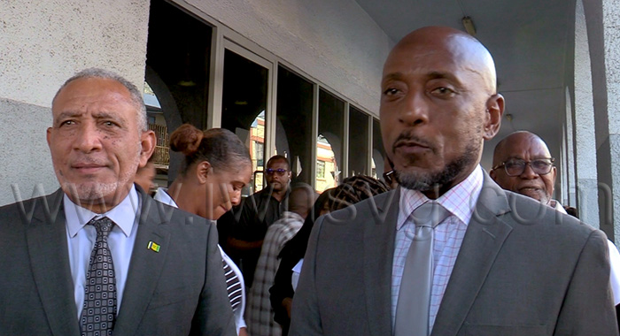 Prime Minister Godwin Friday, left, and East Kingstown MP Dwight Fitzgerald Bramble, the respondents in the election petitions case, speak to iWitness News outside the High Court in Kingstown on Wednesday, Sept. 30, 2026.