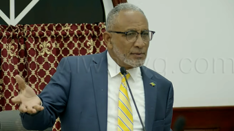 Prime Minister Godwin Friday speaking in Parliament on Aug. 27, 2026. 