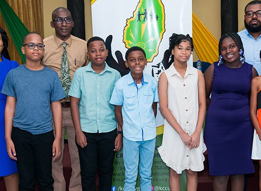 KCCU President Timothy Scott, Vice President Sabita Jacobs-Seymour, CEO Eronne Evans and the scholarship recipients. 