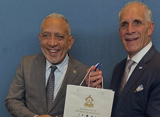 SVG's Prime Minister Godwin Friday, left, and Honduras' President Nasry Juan Asfura Zablah.