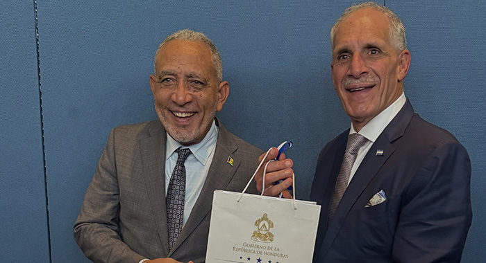 SVG's Prime Minister Godwin Friday, left, and Honduras' President Nasry Juan Asfura Zablah.