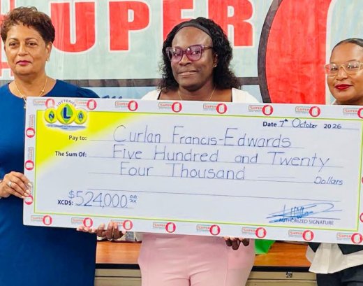 Jackpot Winner Presented: National Lotteries Authority (NLA) Chairperson Luann Hadaway (left) and an NLA official (right) present Curlan Francis Edwards (center) with her promotional cheque for EC$524,000 at the NLA headquarters in Kingstown on Wednesday, October 7, 2026.