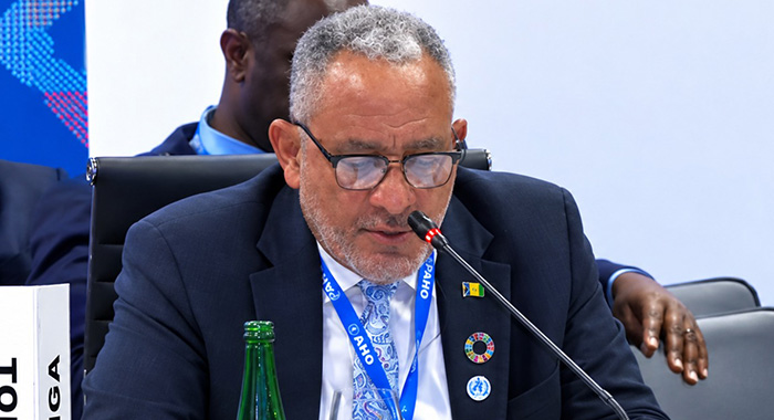 Prime Minister Godwin Friday speaking at the World Bank annual meetings in Thailand. 
