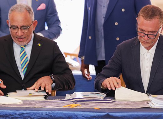 Prime Minister of St. Vincent and the Grenadines, Godwin Friday, left, and Global Ports Holding founder and chief executive Mehmet Kutman at the signing ceremony in Kingstown on Monday, Oct. 26, 2026.