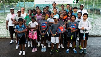 A group photo of junior players and coaches on the final day of the clinic.