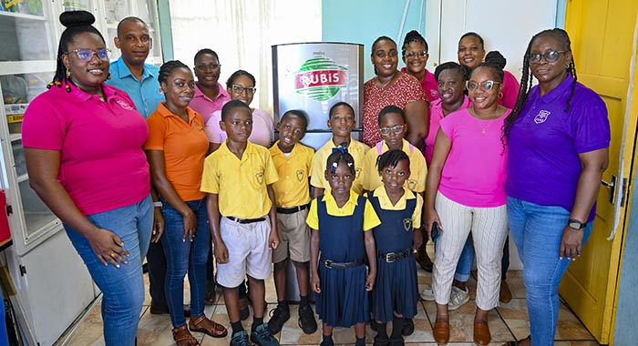 Elroy Edwards, country representative of Rubis, presents a brand-new refrigerator to Nicole Parris on behalf of Lowmans Leeward Anglican Primary School, as part of Rubis's continued commitment to supporting the communities it serves.